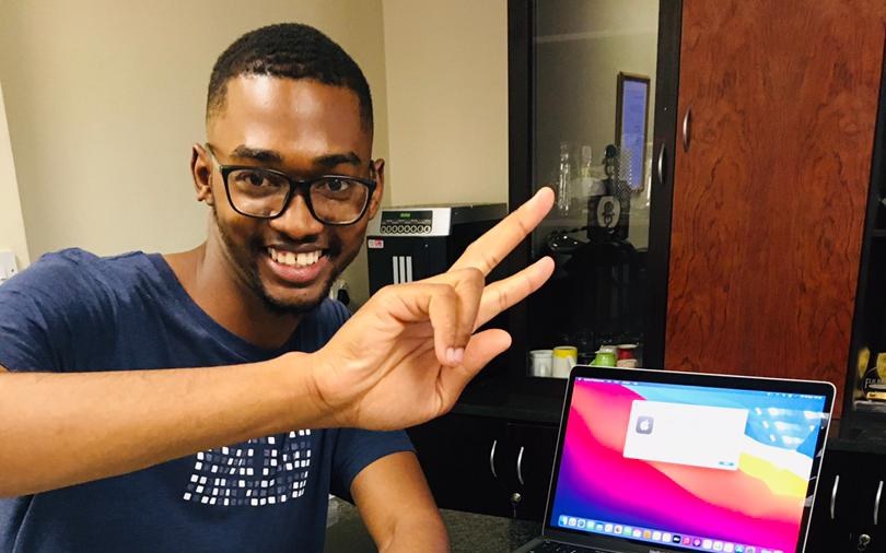 An Africa Code Academy developer with his laptop